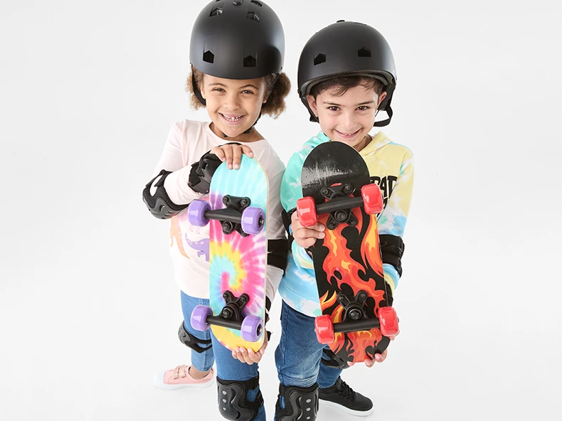 kids holding mini skatebo