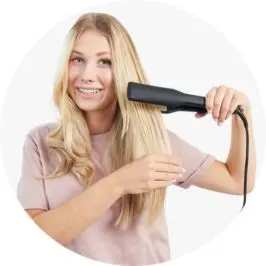 Woman using Wide Plate Hair Straightener 