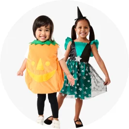 A little boy dressed in a pumpkin Halloween costume and a little girl dressed up a fairy cos