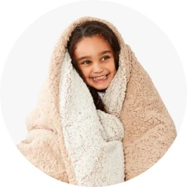 girl wrapped up in a fluffy bla