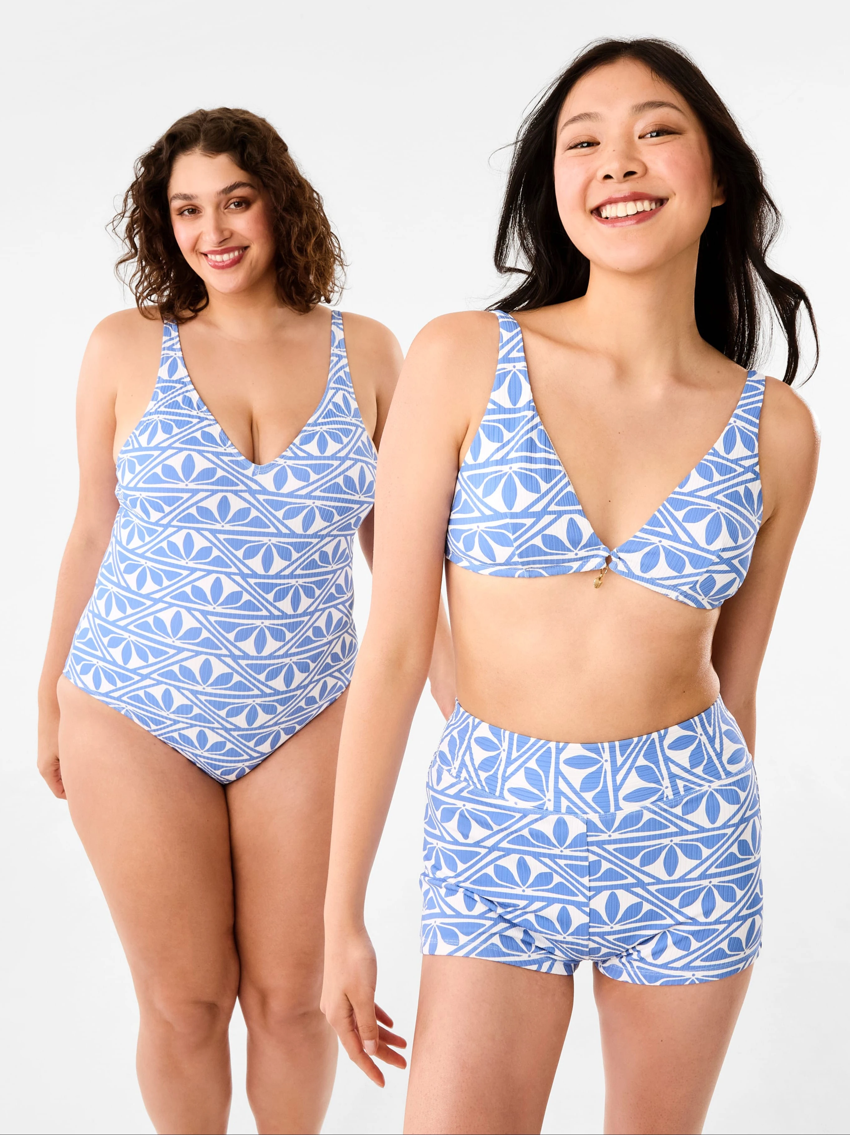 2 women wearing blue bathing suit and bikini