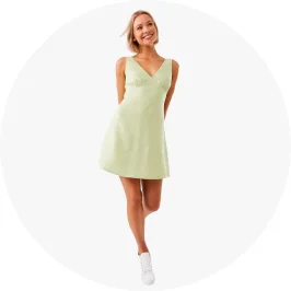 Woman wearing sleeveless V- neck Mini dress in green c