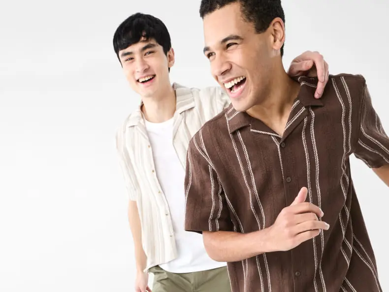 Two male talents wearing two different styled Spring Summer style shirts