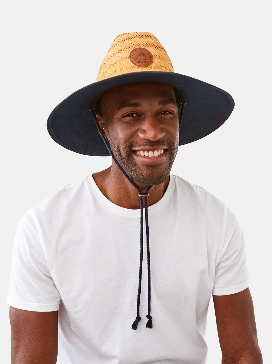 Man Wearing Straw Hat and White T-S