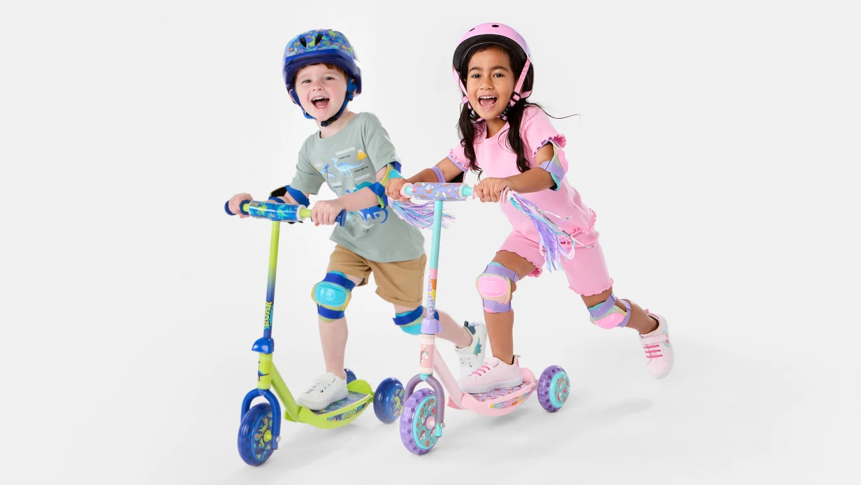 Green and pink kids scooters
