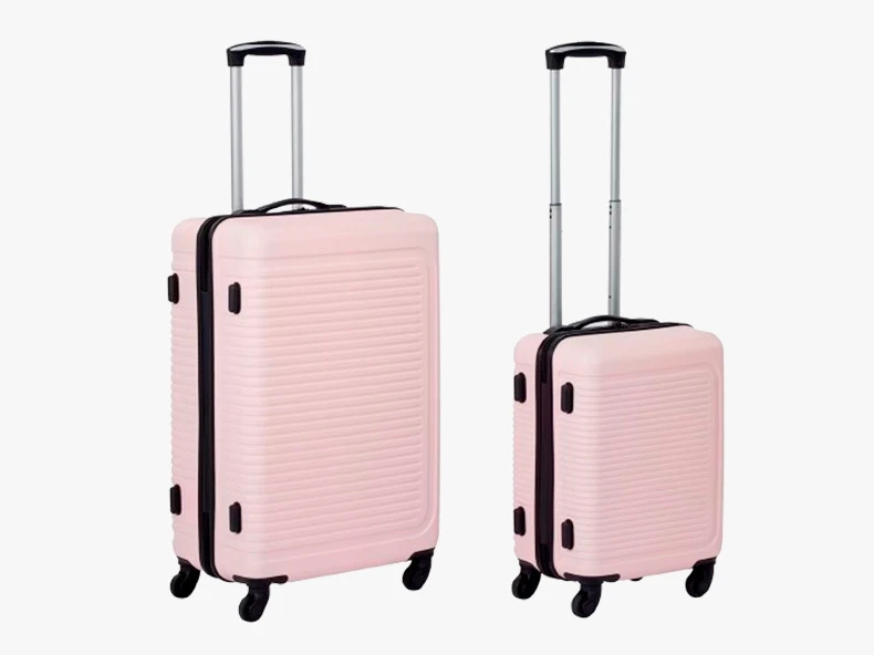 two blush pink suitcases