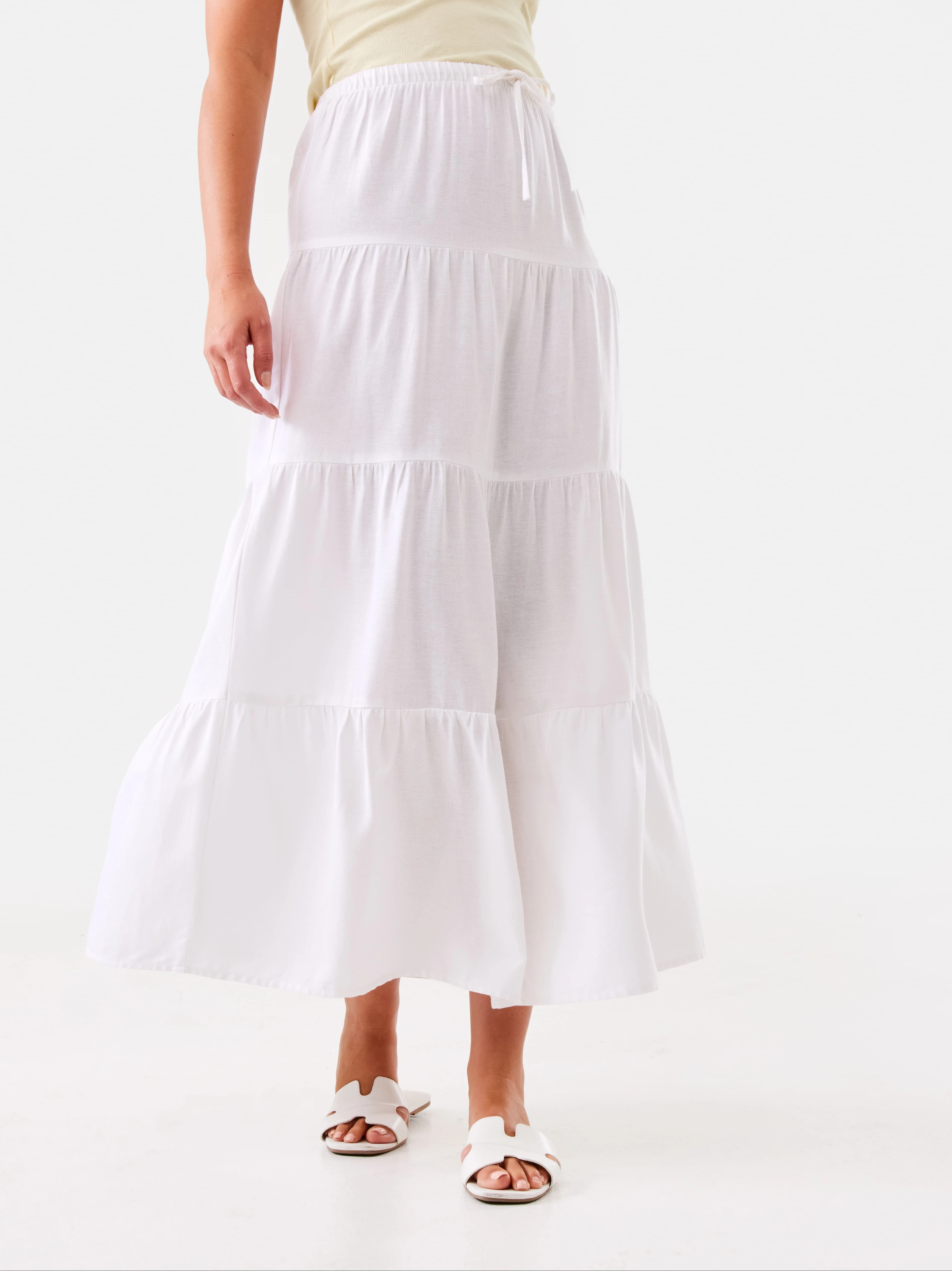 Woman Wearing White Tier Maxi Skirt and Cut Out Detail Sl