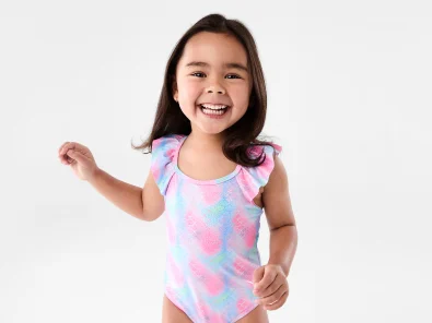 Little girl wearing blue and pink swim wear