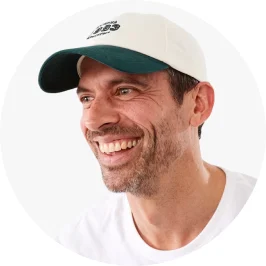 Man Wearing White Colour Unstructured Baseball