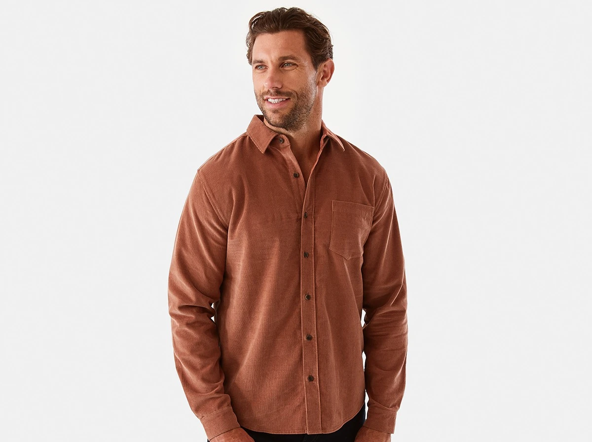 Man wearing long sleeve corduroy shirt