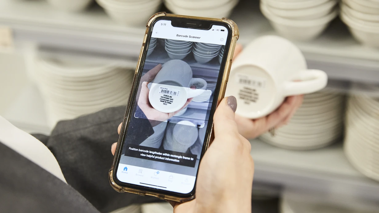 Customer scanning the product in KMART store using KMART App scanning feature