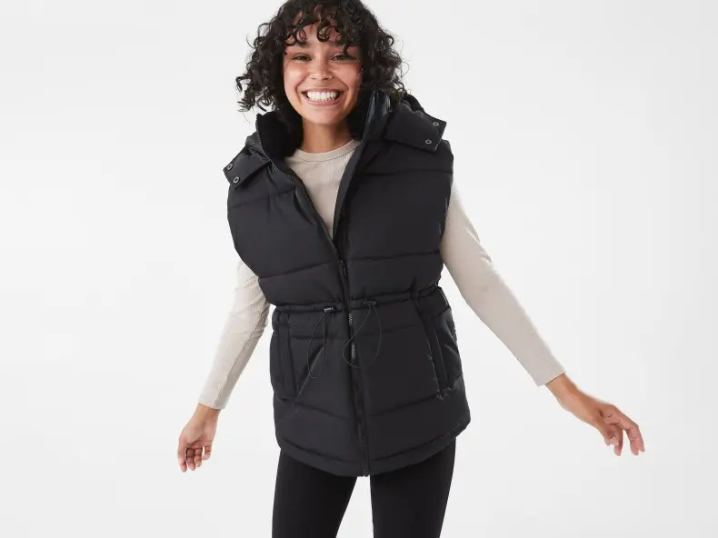 woman wearing a black padded puffer vest