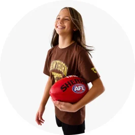 Girl holding AFL Sherin Mini Football in Red Co