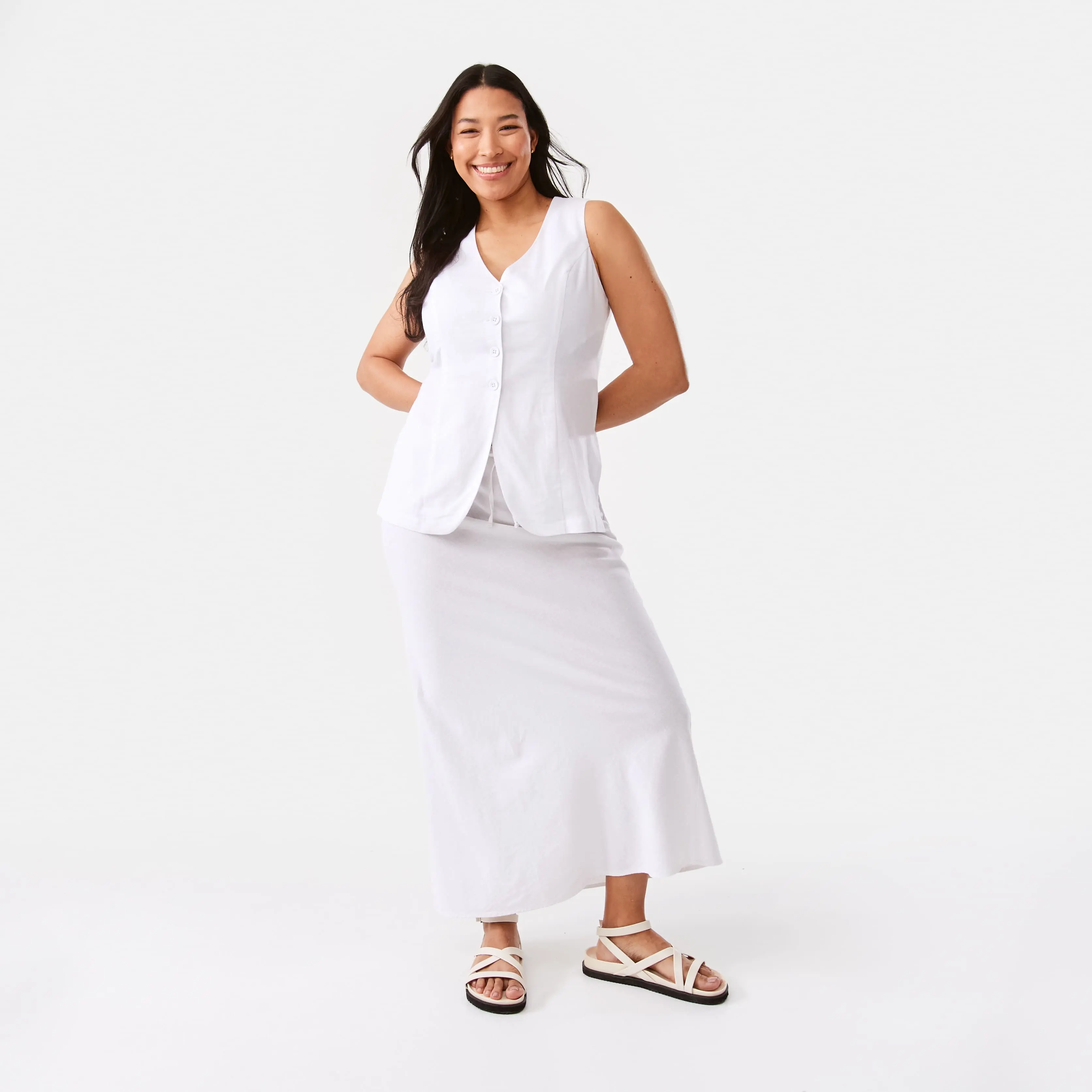 White Maxi Skirt paired With White Sleeveless Buttoned Waistcoat