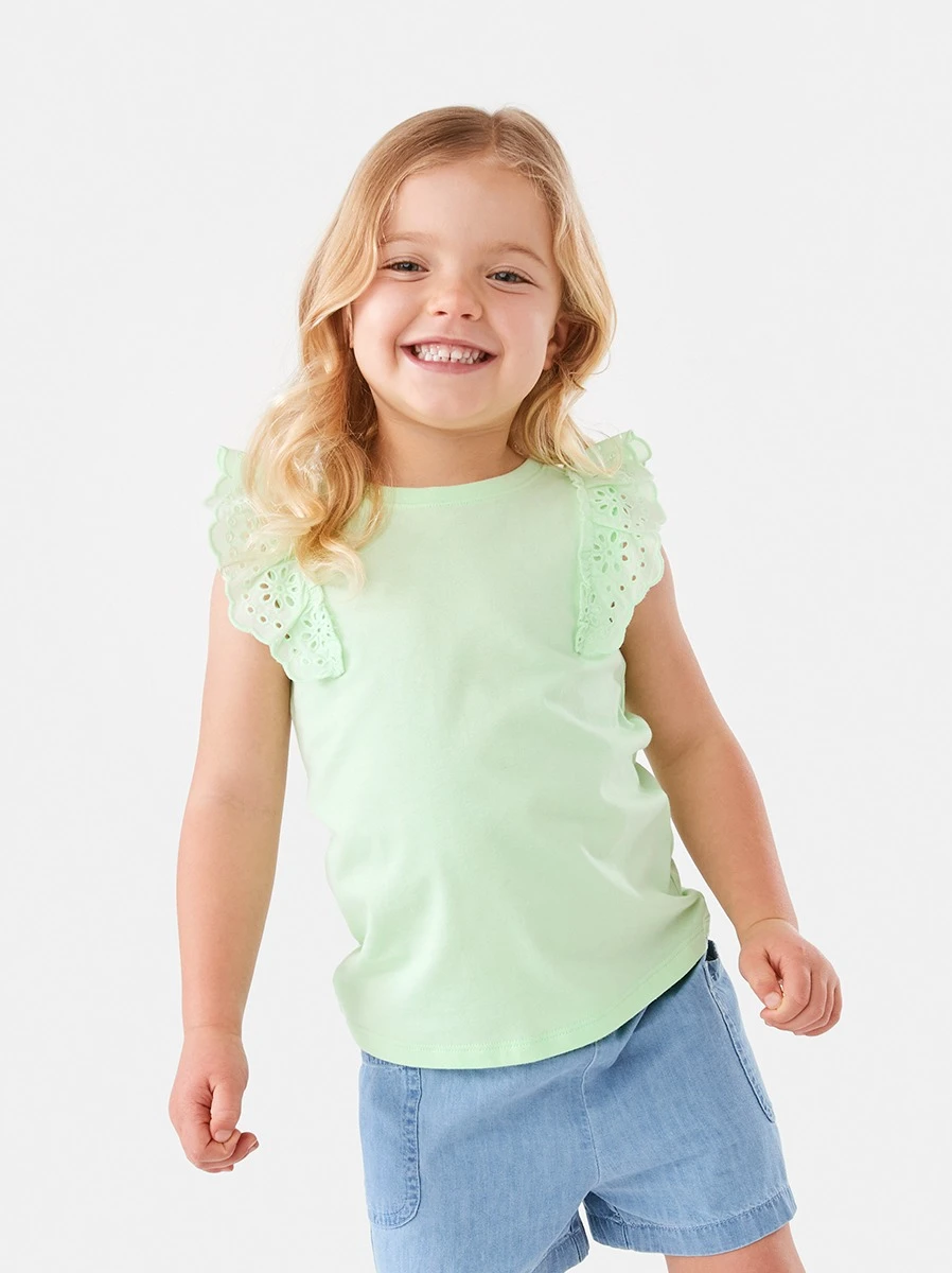 Young Girl Wearing Green Broderie Frill Sleeve T-s