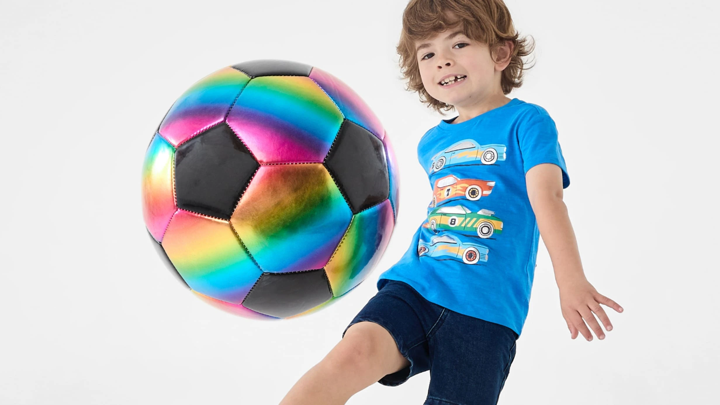 Kid playing with Rainbow Soccer ball