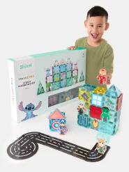 Boy playing with Learning games like magnetic tiles