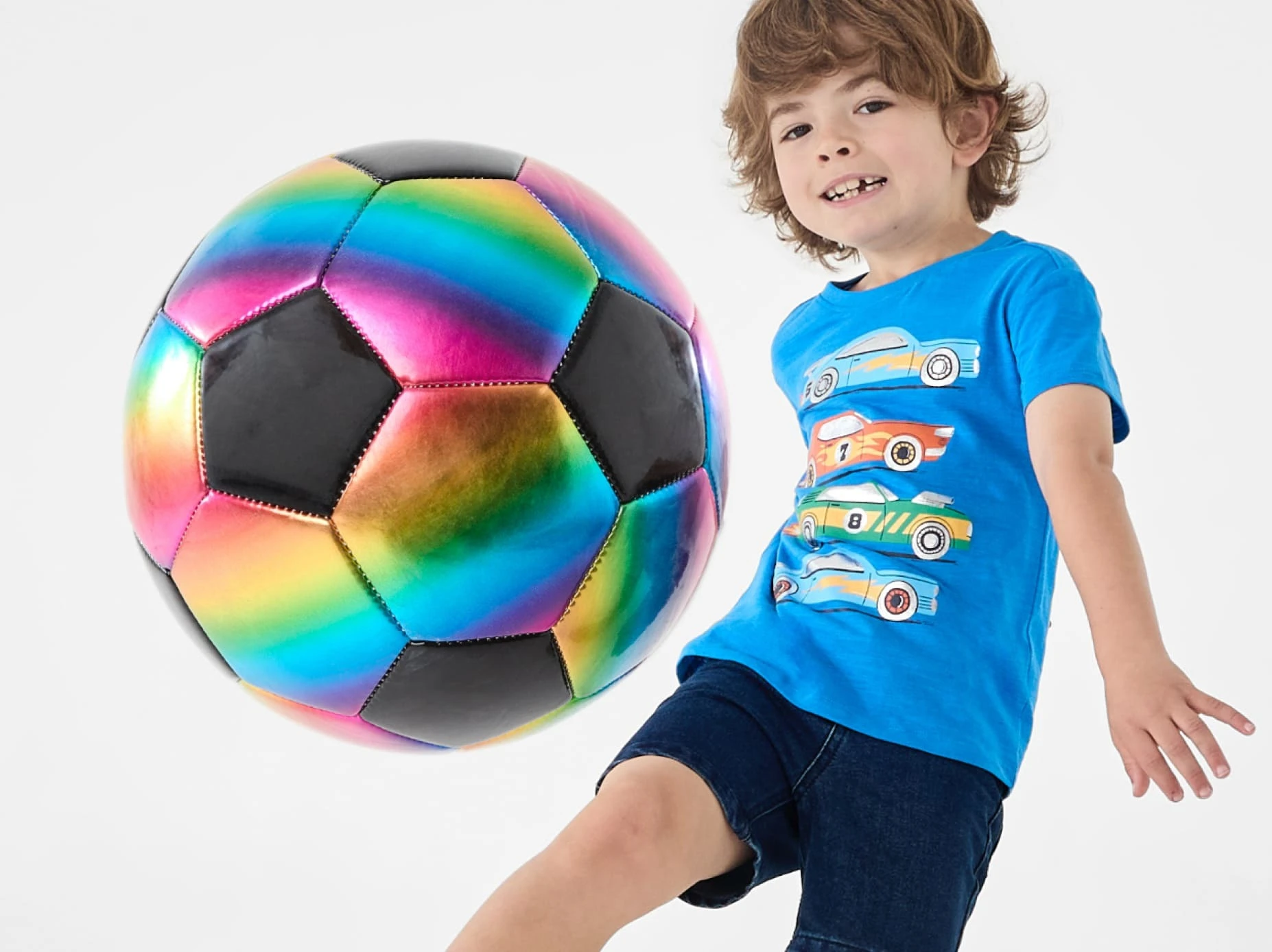 Kid playing with Rainbow Soccer ball