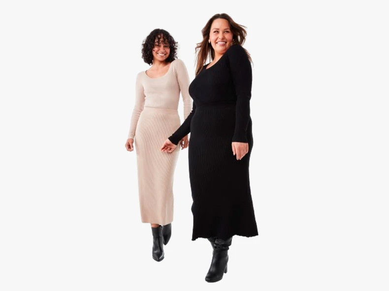 two women wearing long sleeve dresses