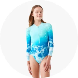 Girl wearing wave splash print long sleeve swim