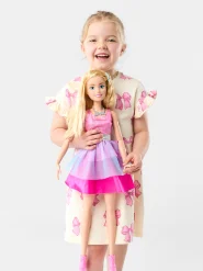 Girl playing with Barbie 