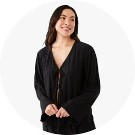 Woman Wearing Black Long Sleeve Textured Tie Front