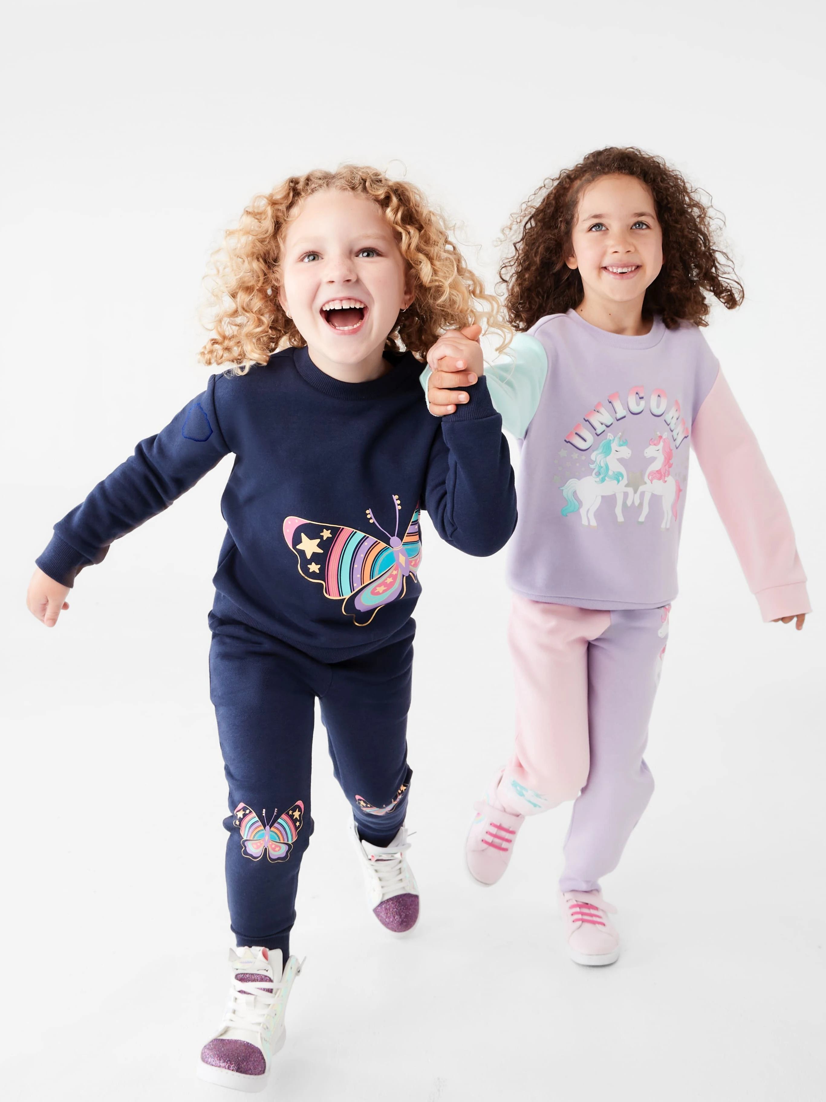 two little girls in kids clothing matching sweat 