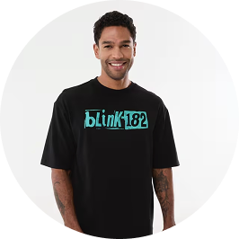 a man wearing blink 182 license ts