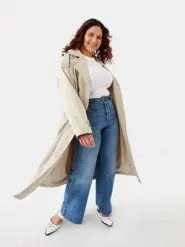 Woman Wearing Longline Trench with Blue Denim Jeans and White