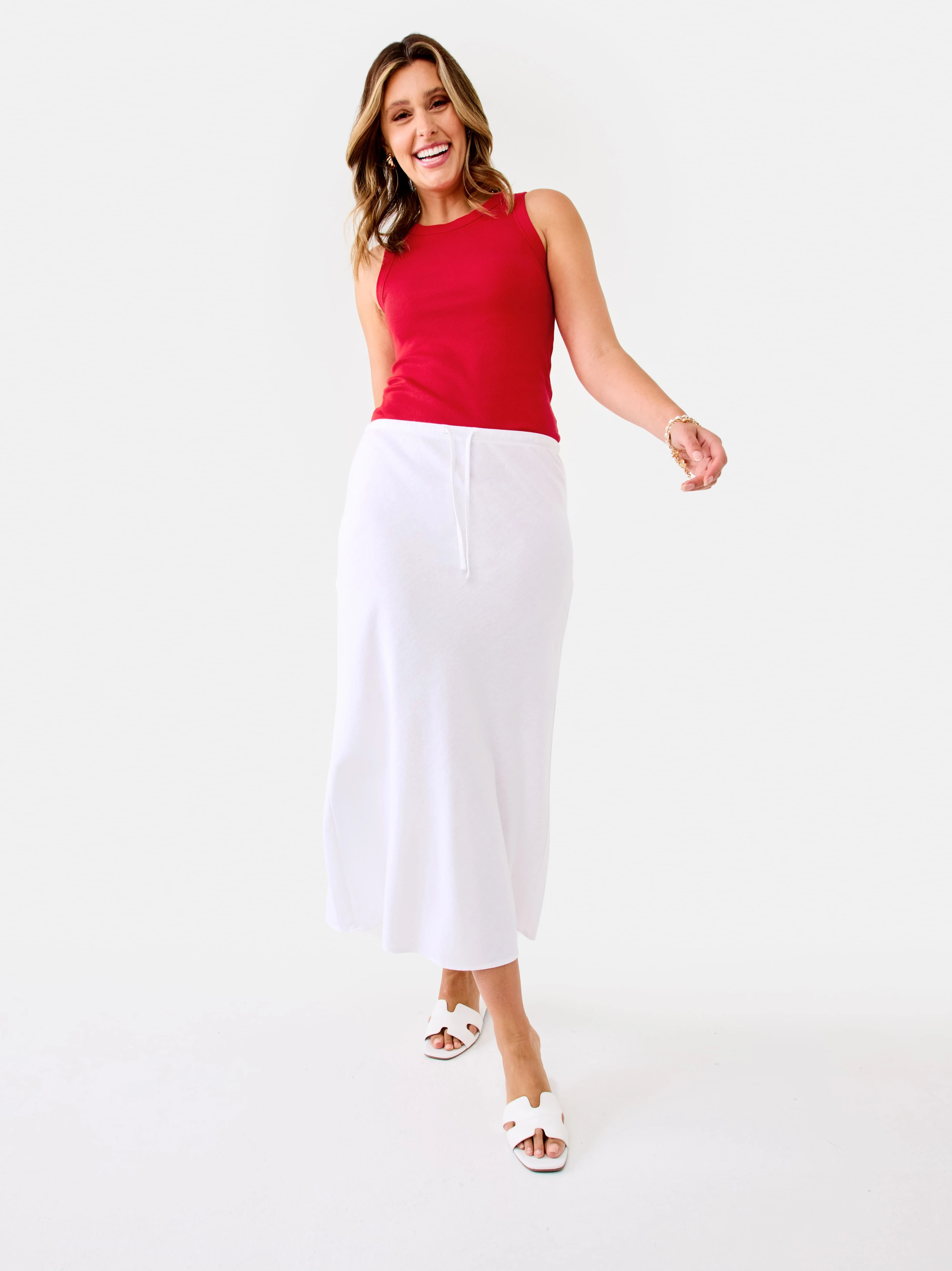 Woman wearing red top and linen blend white s