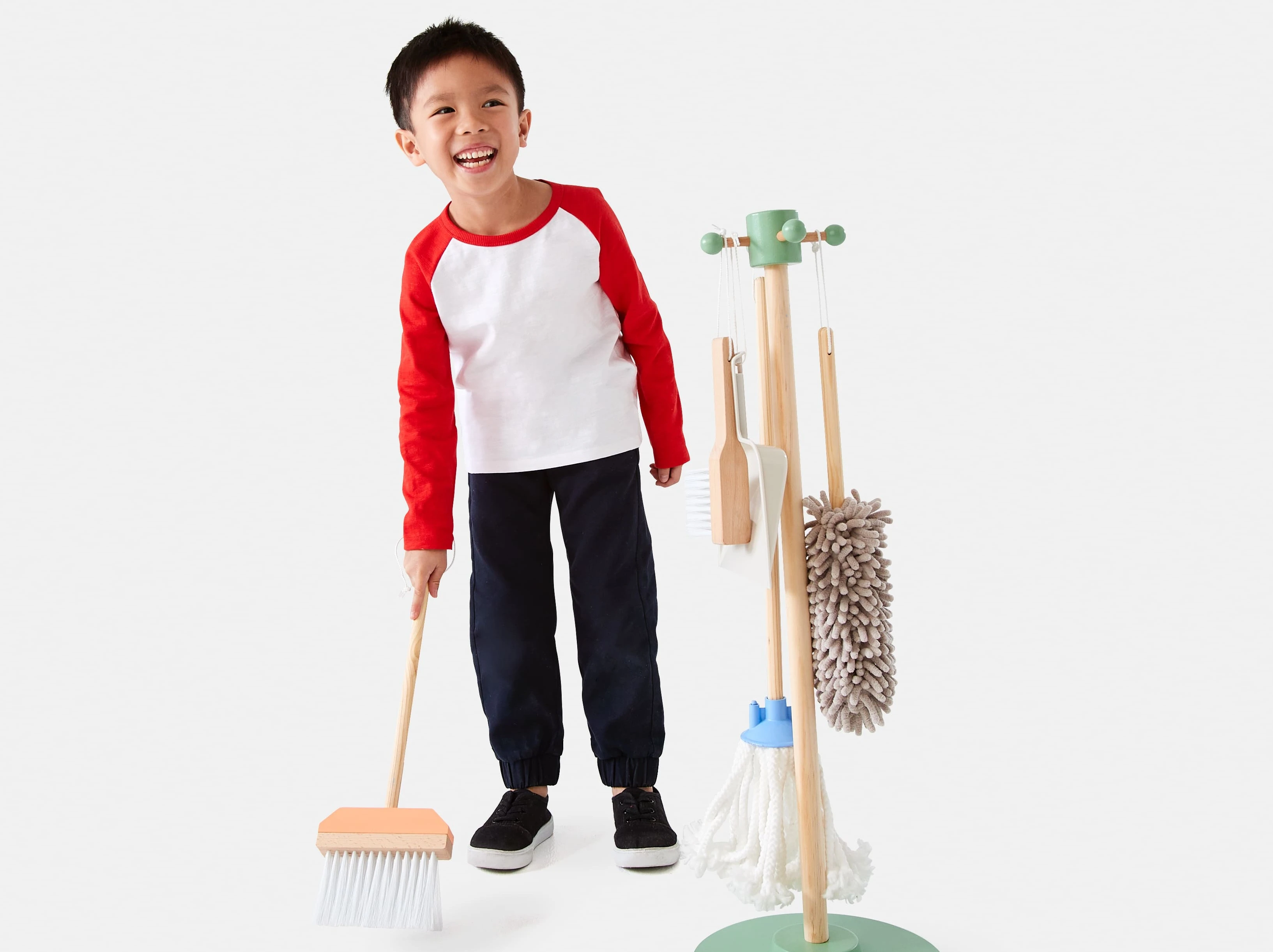 Boy with 6 piece wooden cleaning toy