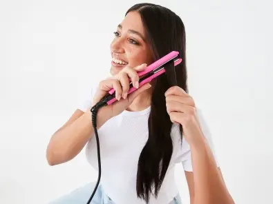 Talent using the mini straightener in hot pink 