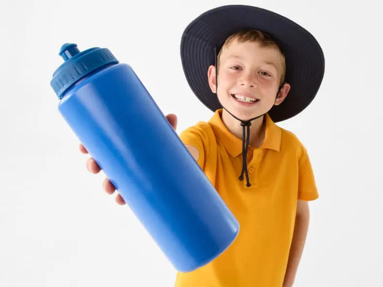 Little boy with drink bottle in hand