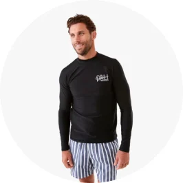 Man Wearing Black Long Sleeve Print Rash Vest and Striped Sh