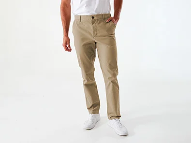 Man Wearing Straight Stretch Chino Pants in Beige Colour