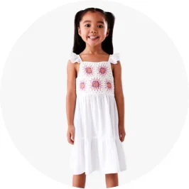 Young girl wearing white crochet tier d