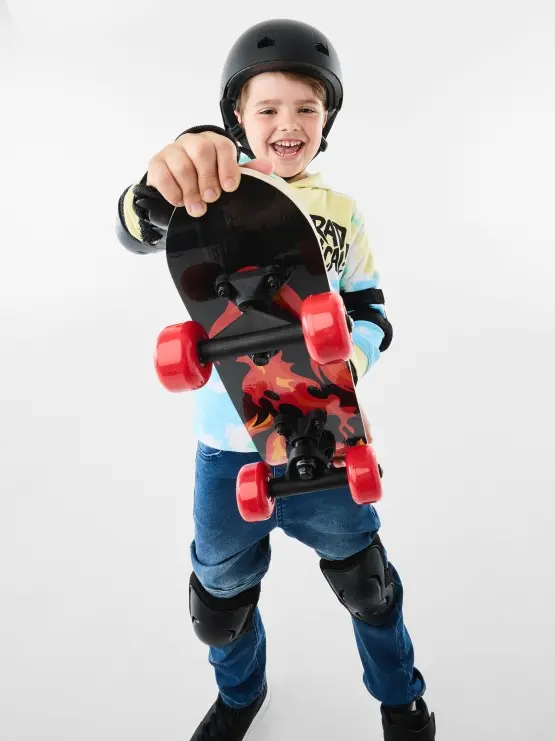 Boy holding a skateb