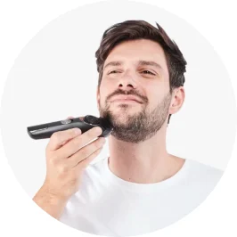 Man using black color beard trimmer