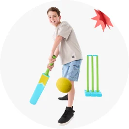 Boy playing with beach cricket