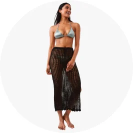 Talent Wearing Crochet Maxi Black Skirt Paired with Silver Bik