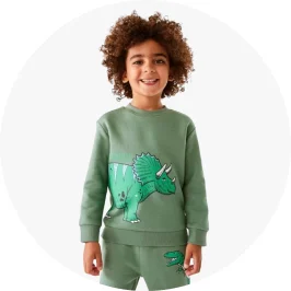 boy wearing dinosaur ju