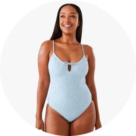 Woman Wearing Broderie Scoop Neck Tie Front One Piece in Haze Blue Co