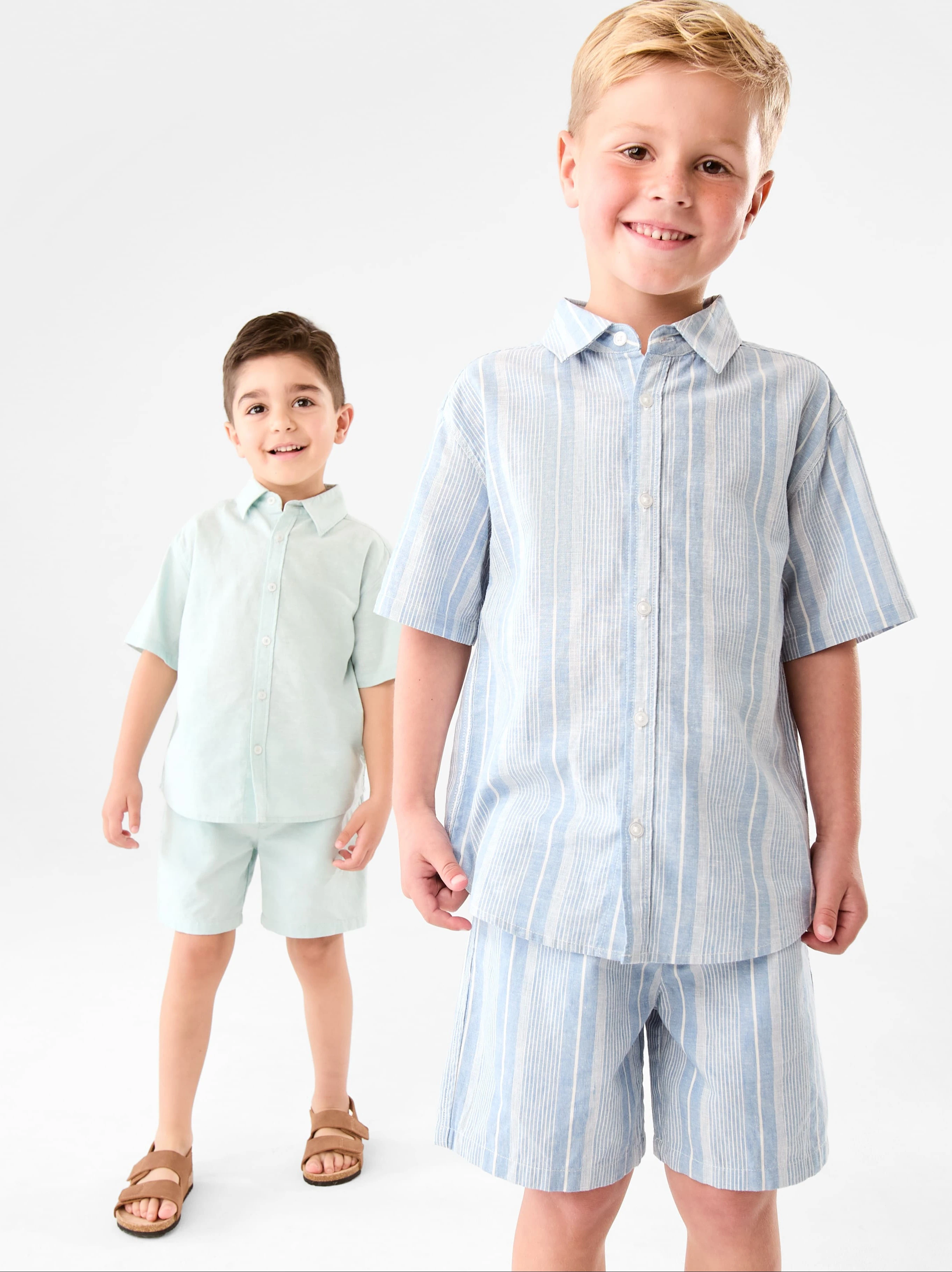 2 boys wearing summer matching top and sh