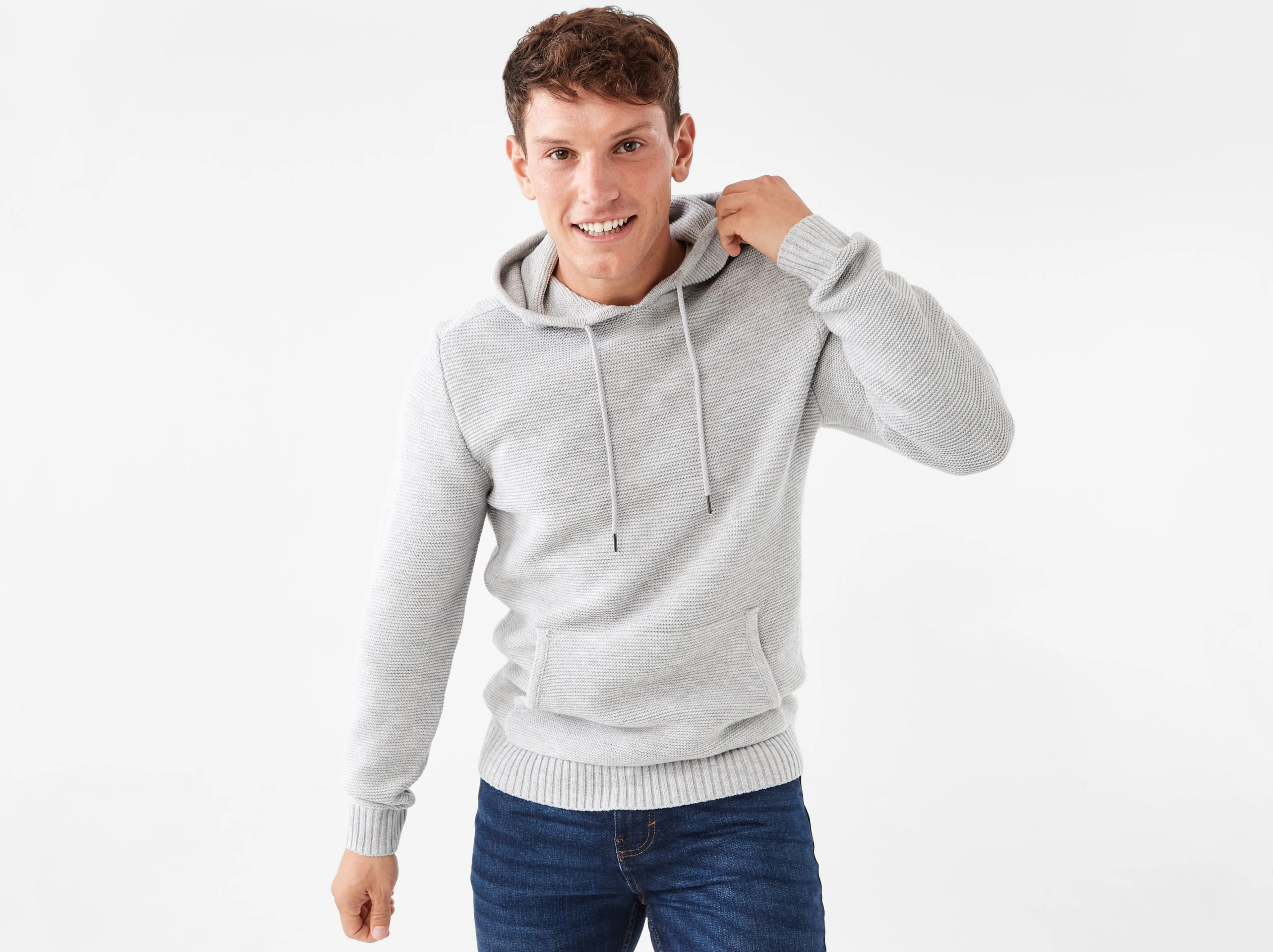 a man wearing a grey knit ho