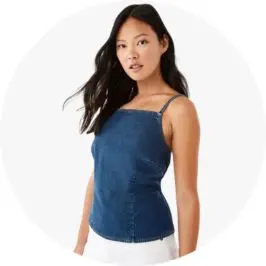 Woman Wearing Sleeveless Buckle Back Denim Top