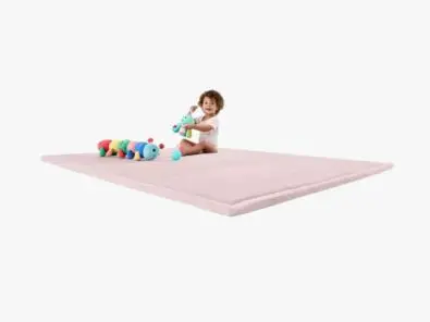 Toddler sitting on a Soft Play Mat - Pink