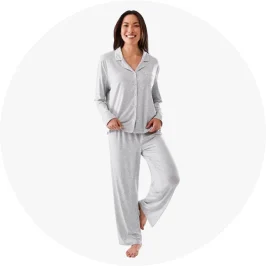 a woman in a grey matching pyjamas