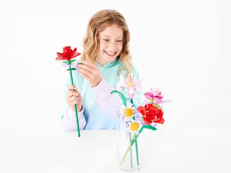 girl assembling a Flower Construction Kit