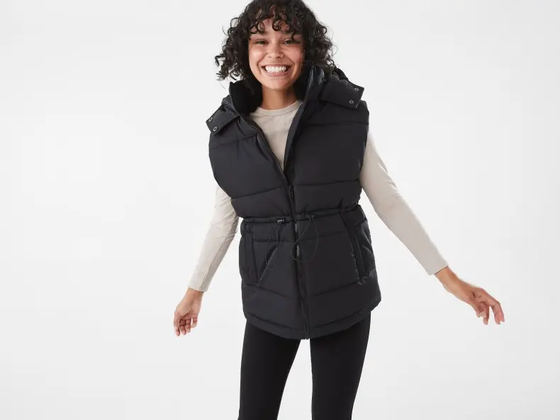 womens wearing a black puffer vest