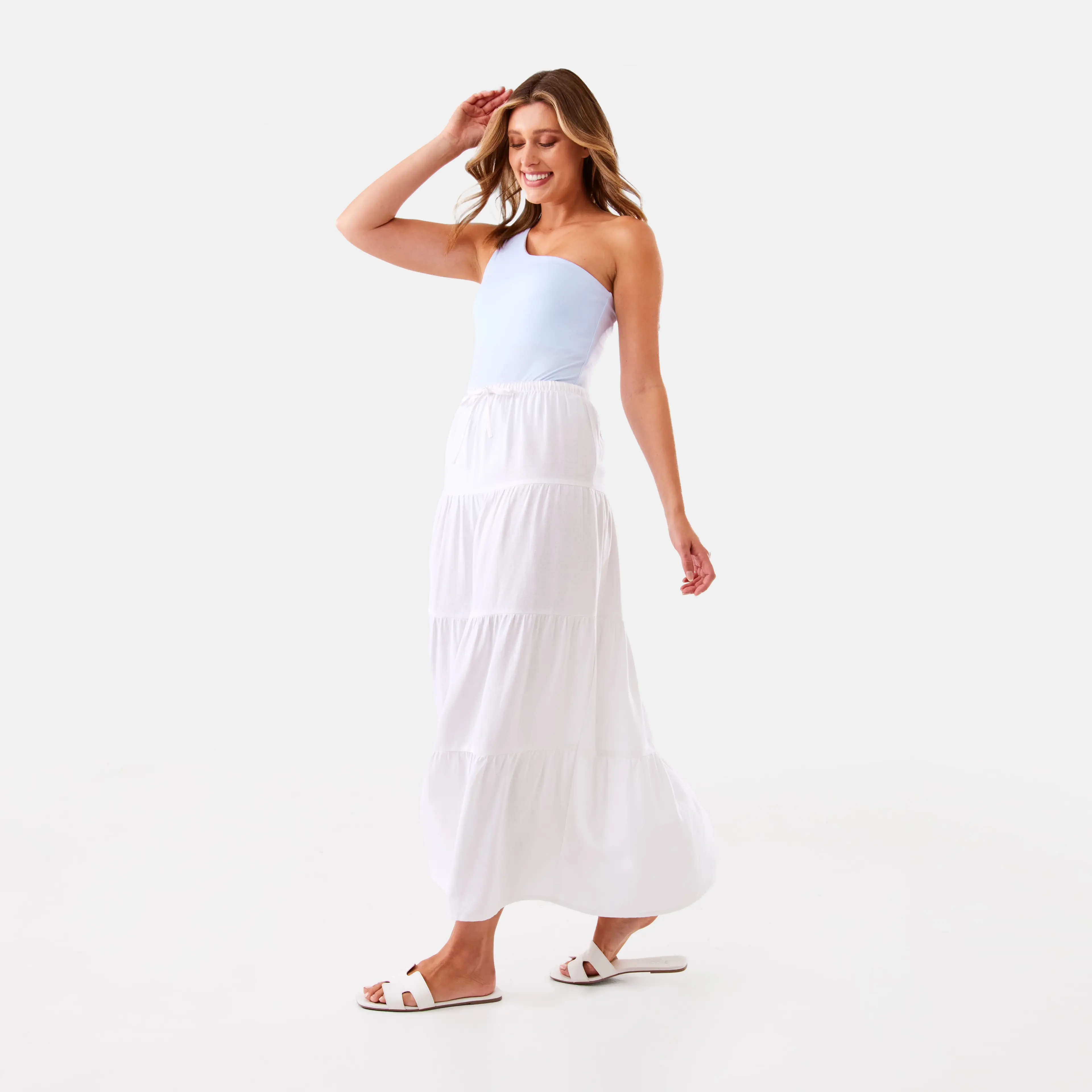 Woman Wearing White Tiered Skirt and Sleeveless Pastel Blue Bodysuit